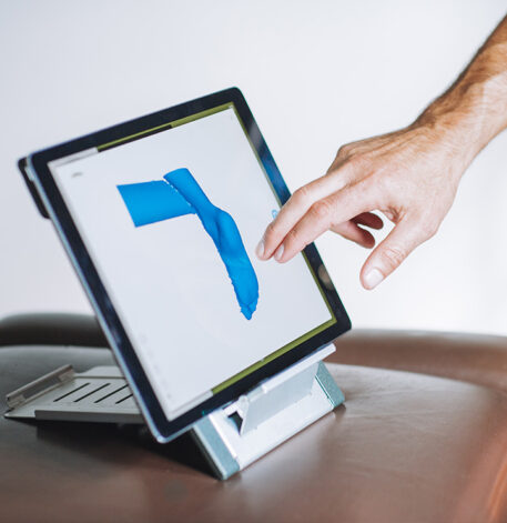 Podiatry is using monitor to detect pain of the client leg